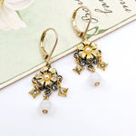 Golden Drop Flower Earrings by Eric et Lydie