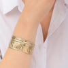 Enchanting Gold Adjustable Feather Bracelet by Satellite Paris
